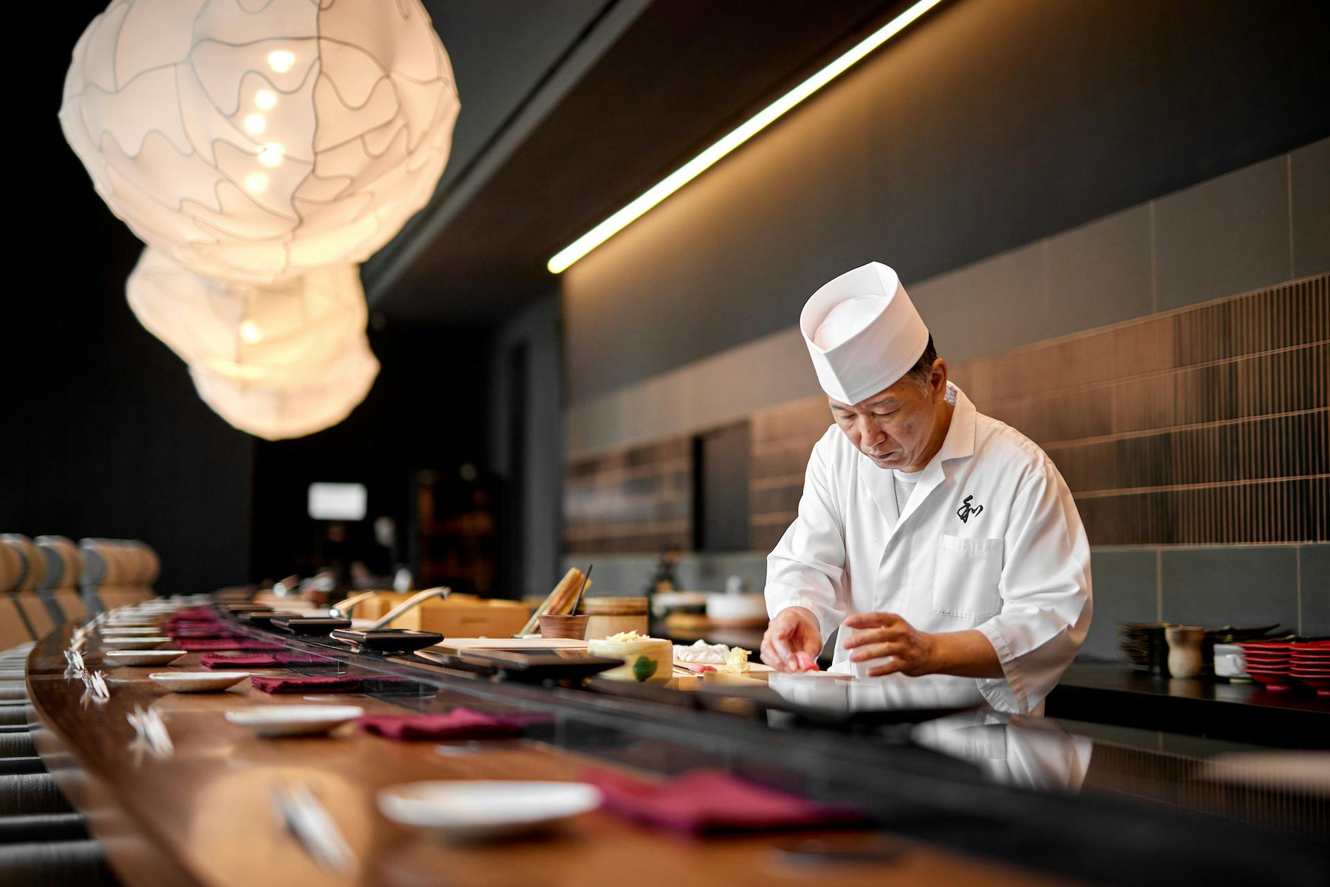 chef norikazu shibata preparing sushi